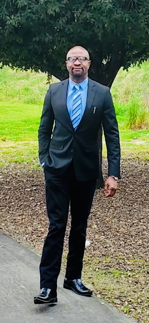 Ralph Nwobi in professional attire